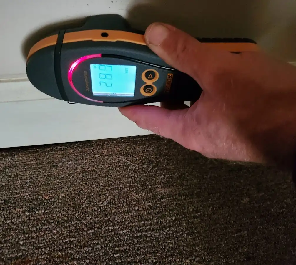 Moisture detection at baseboard during Storm Damage Restoration in Bradfordville